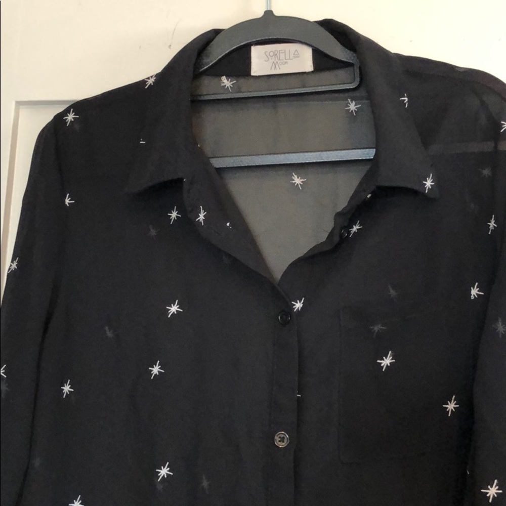 Sheer black blouse with embroidered stars